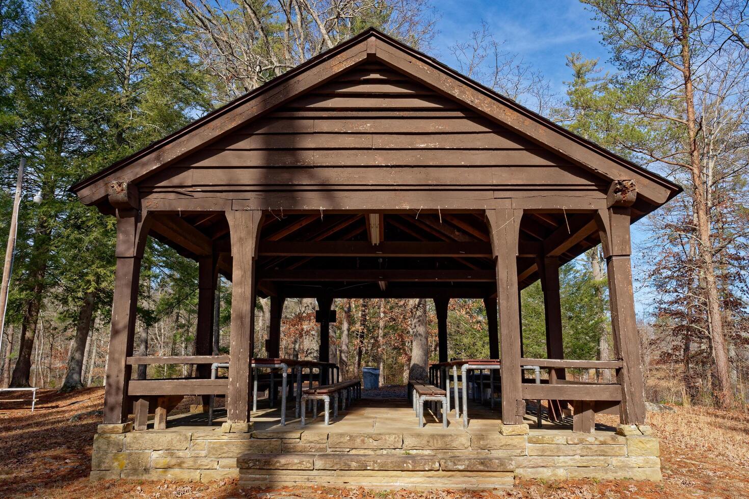 Rustic picnic shelter in a public park photo