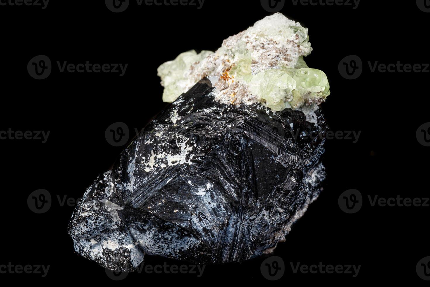 Macro stone Hyalite mineral, tourmaline Sherl, smoky quartz on a black background photo