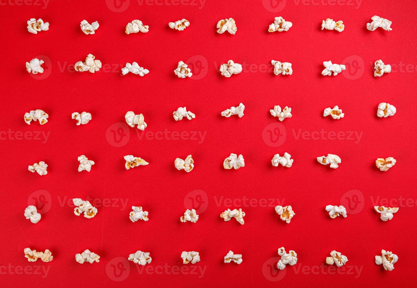popcorn macro on a red background photo