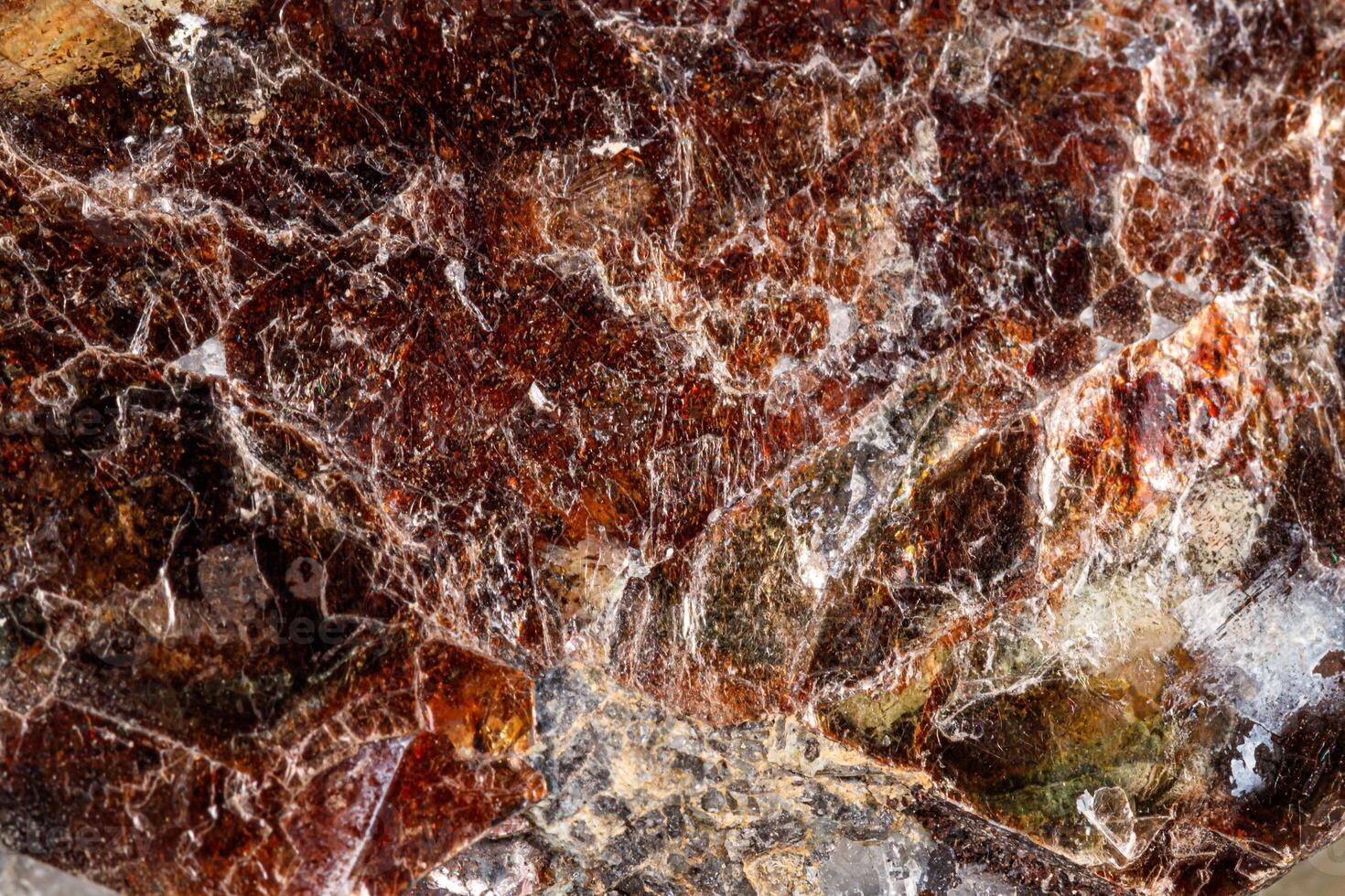 Macro of a mineral stone Vesuvianite on a white background photo