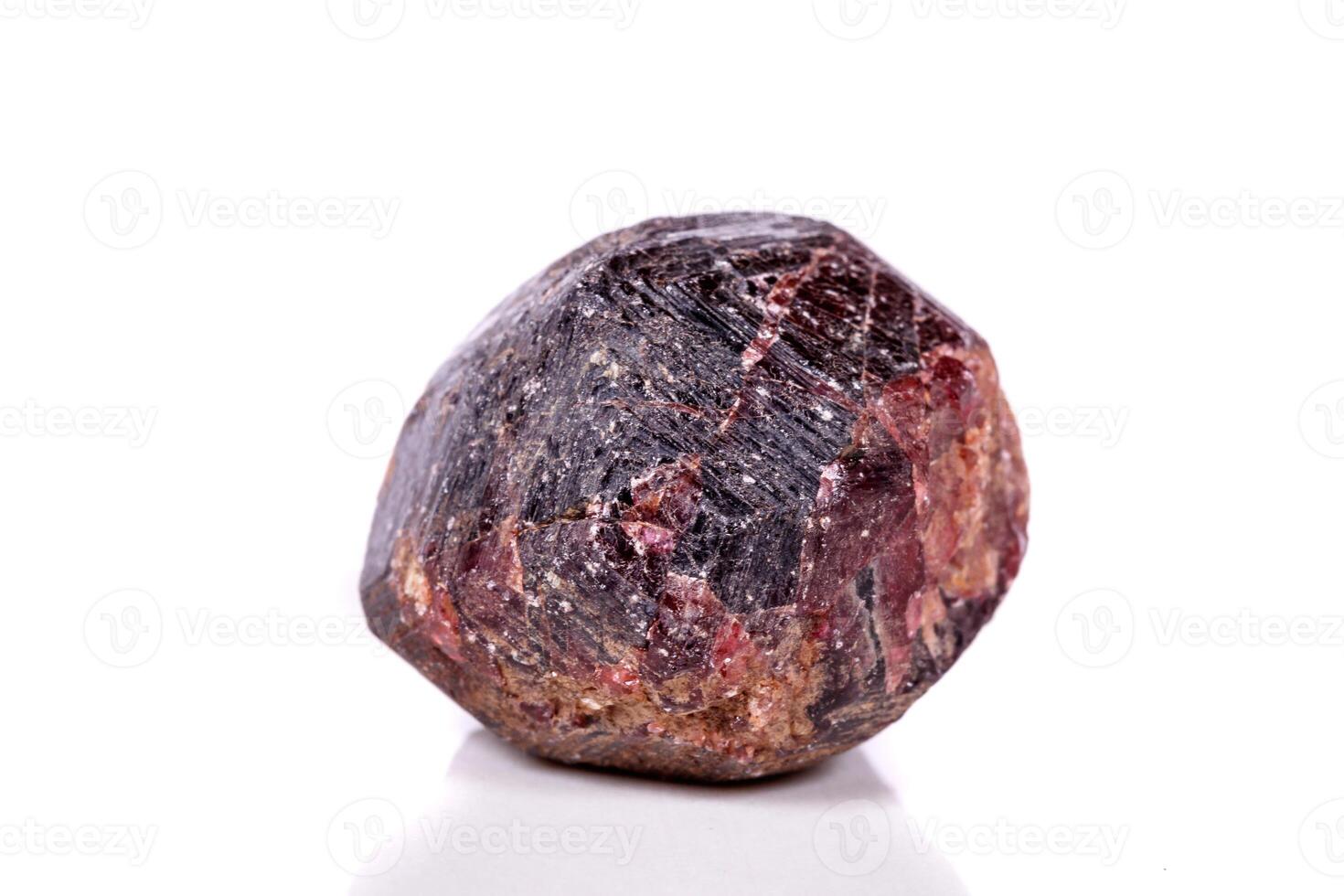 Macro of a mineral garnet stone on a white background photo