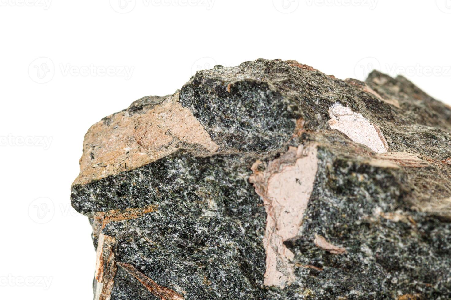 Macro stone mineral Diopside Calcite Magnetite on a white background photo