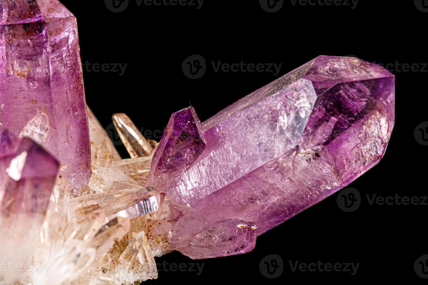 Macro of amethyst mineral stone on black background photo