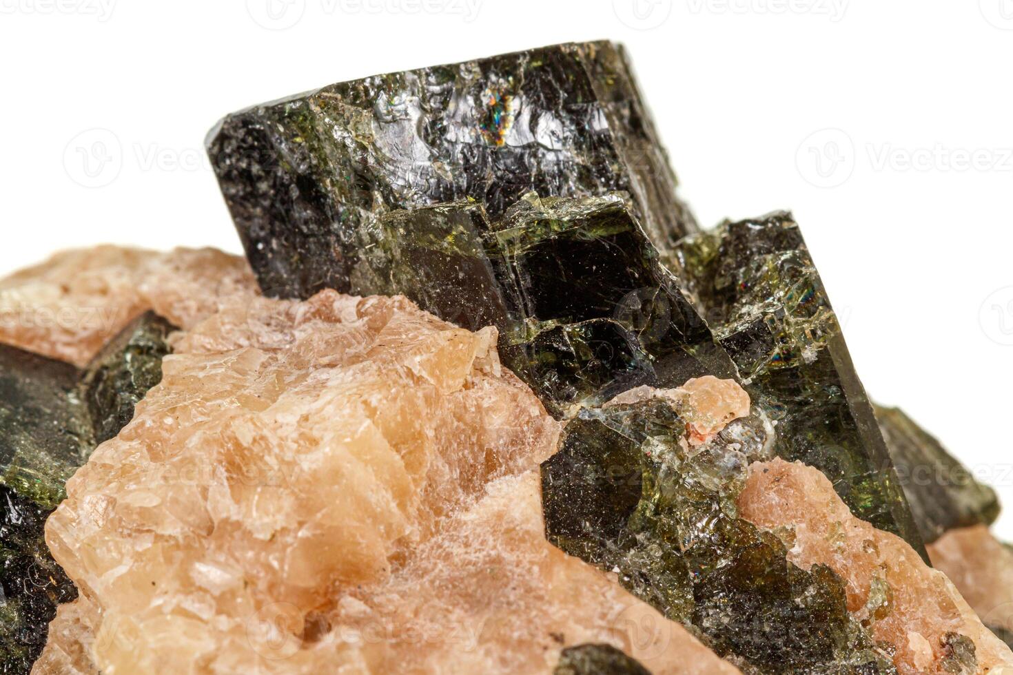 Macro of a mineral stone Vesuvianite on a white background photo