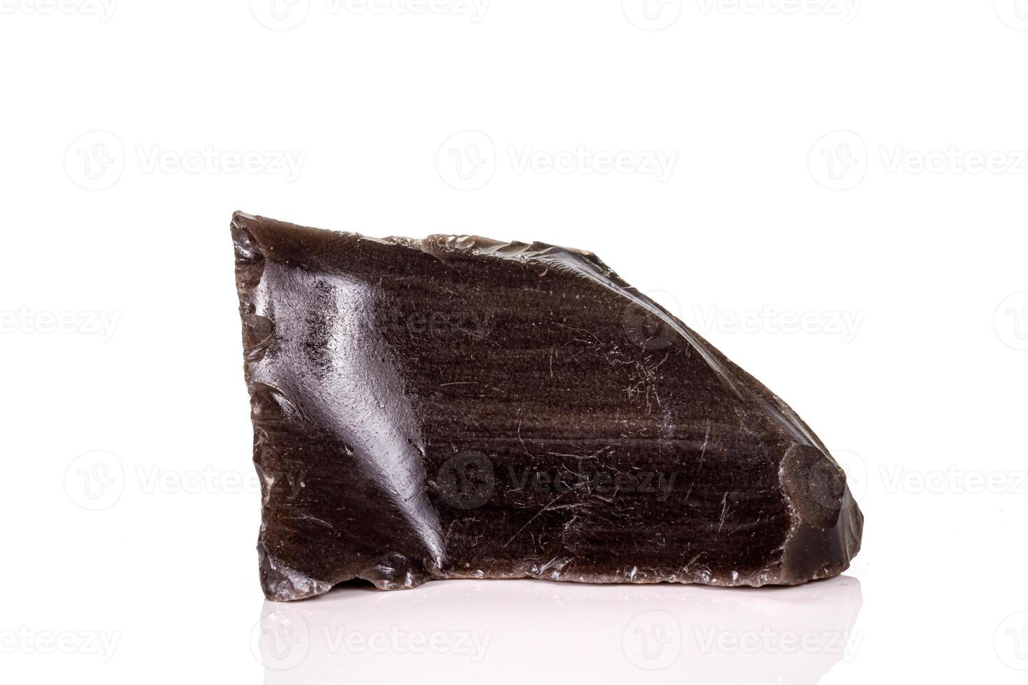 Macro stone obsidian mineral on white background photo