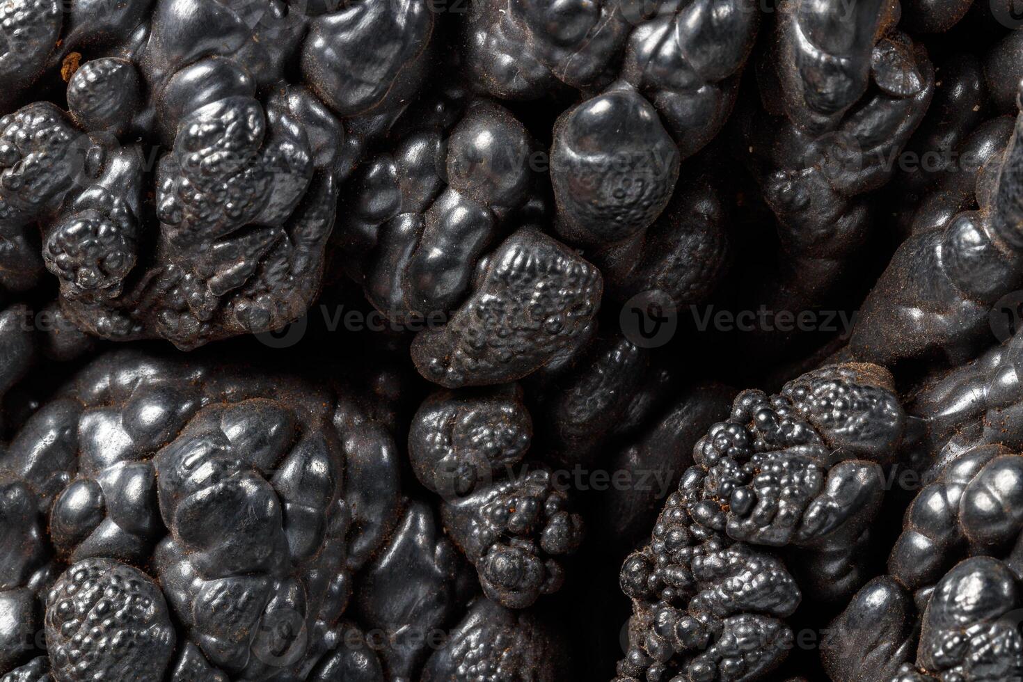 Macro mineral Hematite stone on a white background close-up photo