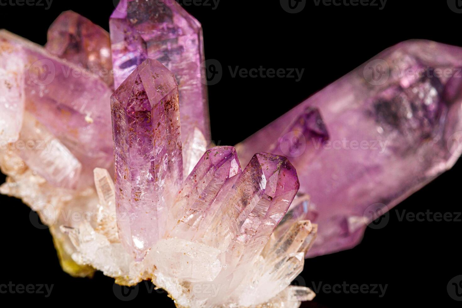 Macro of amethyst mineral stone on black background photo