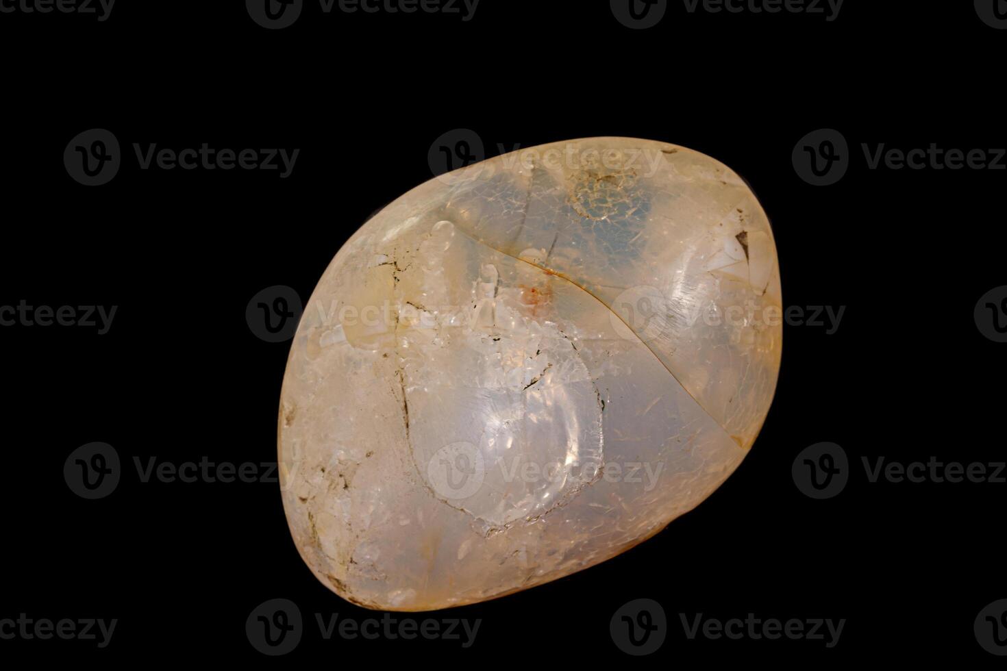 Macro stone opal mineral on a black background photo