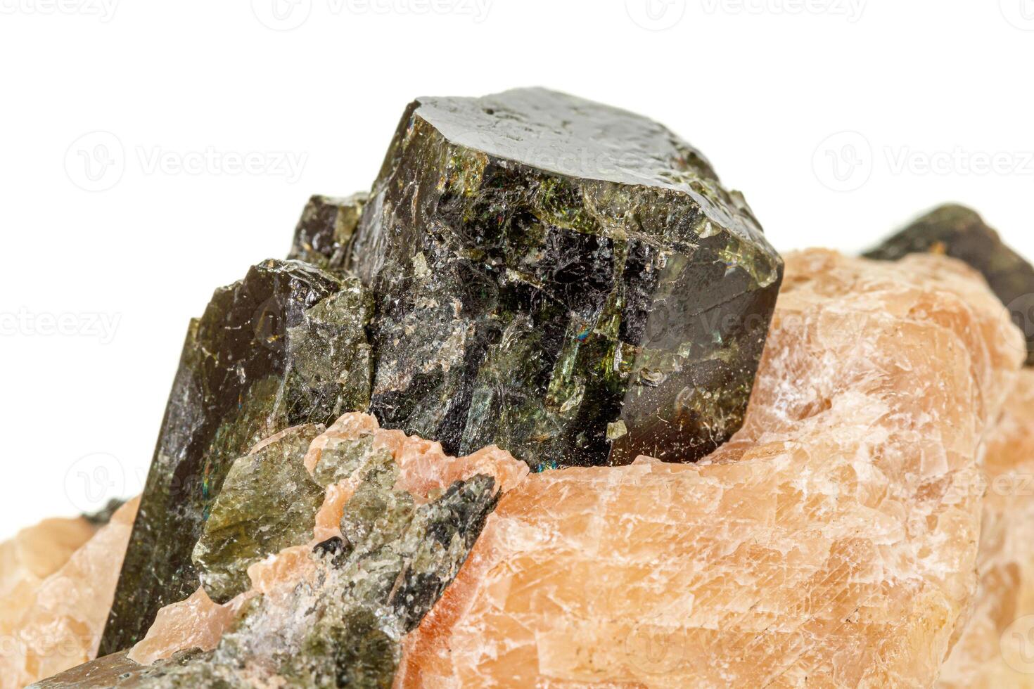 Macro of a mineral stone Vesuvianite on a white background photo