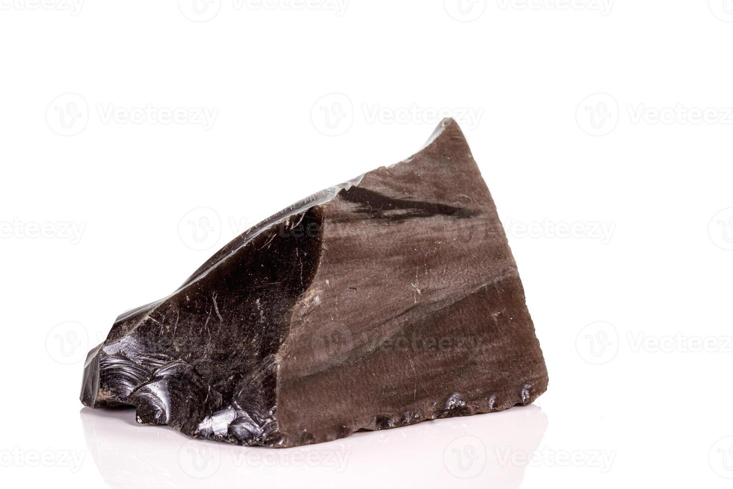 Macro stone obsidian mineral on white background photo