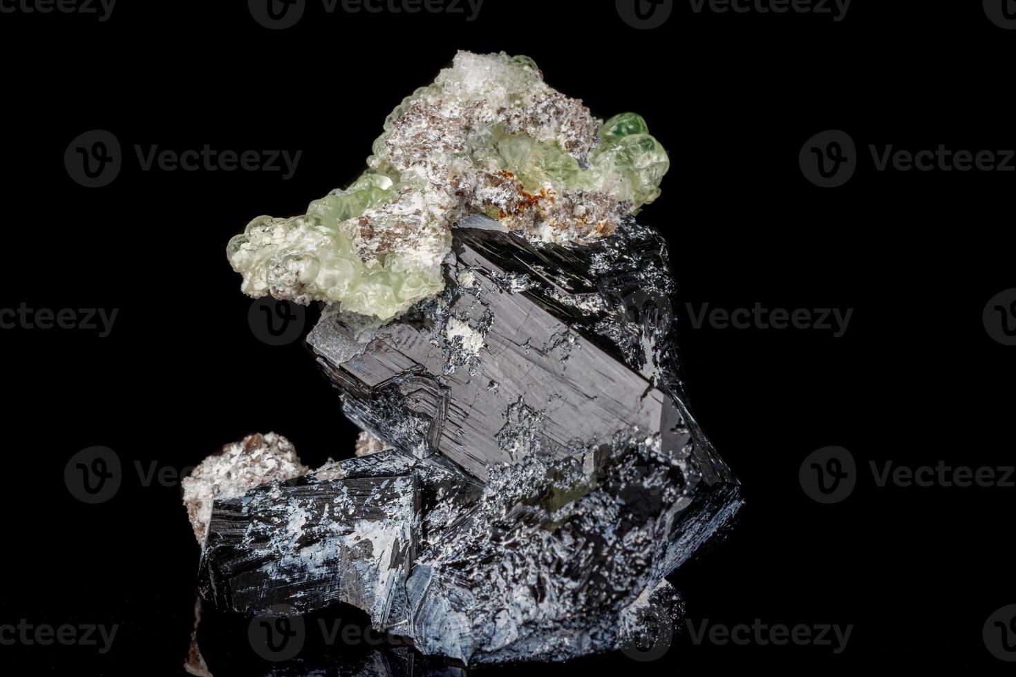 Macro stone Hyalite mineral, tourmaline Sherl, smoky quartz on a black background photo
