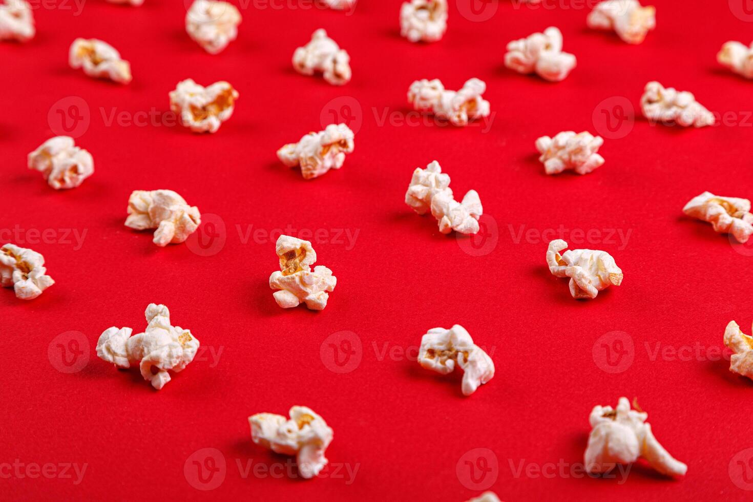 popcorn macro on a red background photo
