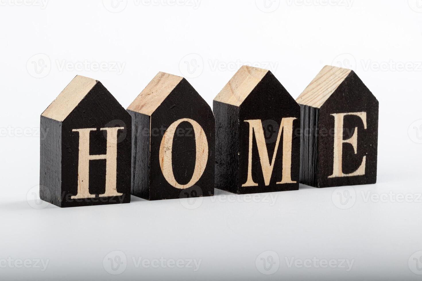 Wooden cubes with the inscription home on a white background photo