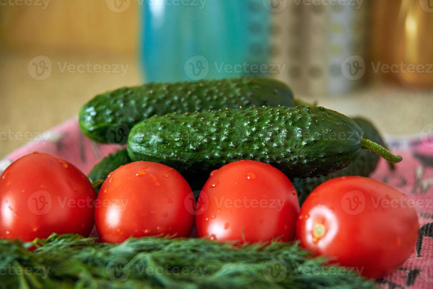 Tomatoes, cucumbers and green dill close-up, fresh harvest, preparation for salad, diet food photo