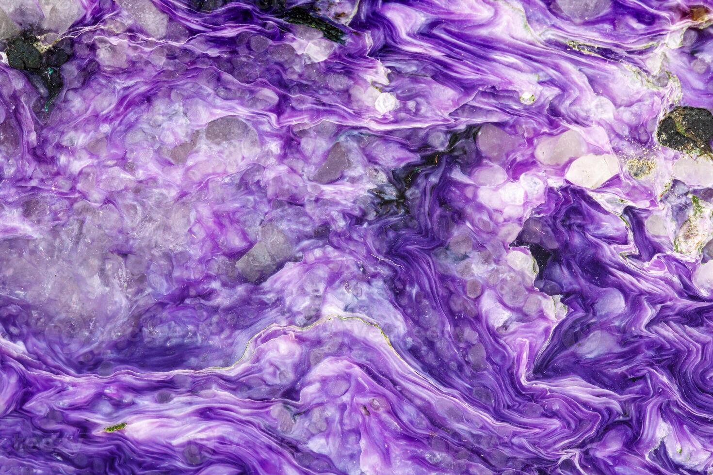 Macro stone Charoite mineral on white background photo