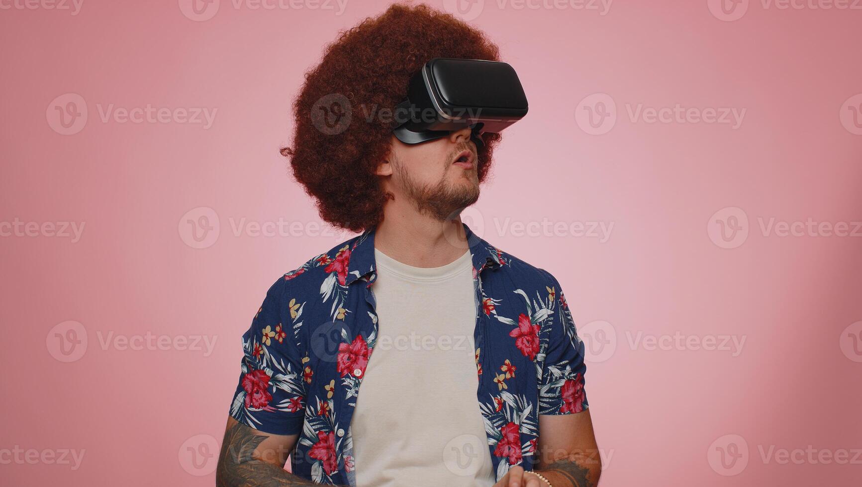 Man using virtual reality futuristic technology VR headset helmet to play simulation 3D game photo