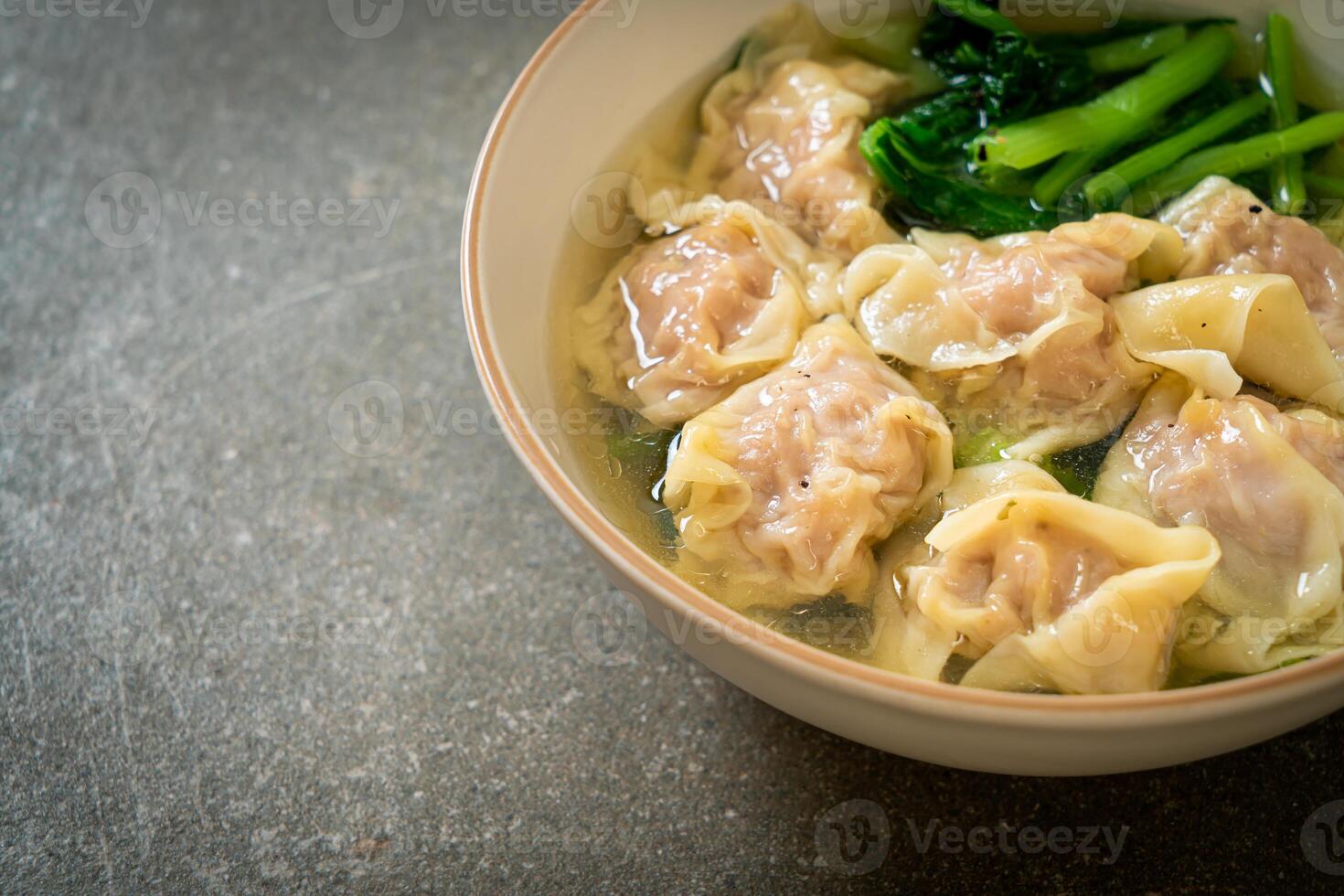 pork wonton soup or pork dumplings soup with vegetable photo