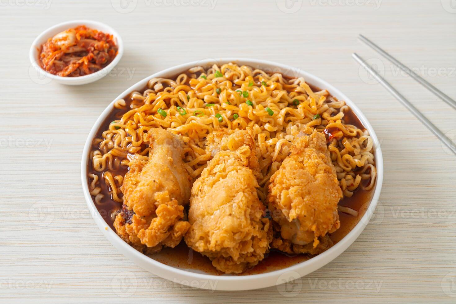 Korean instant noodles with fried chicken or Fried chicken ramyeon photo