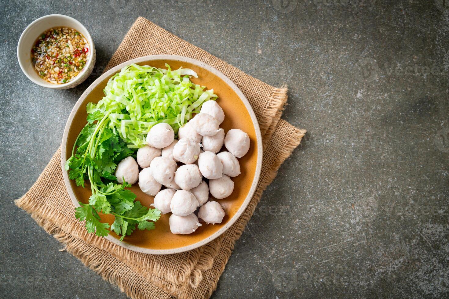 pork meatball with vegetable and spicy sauce photo
