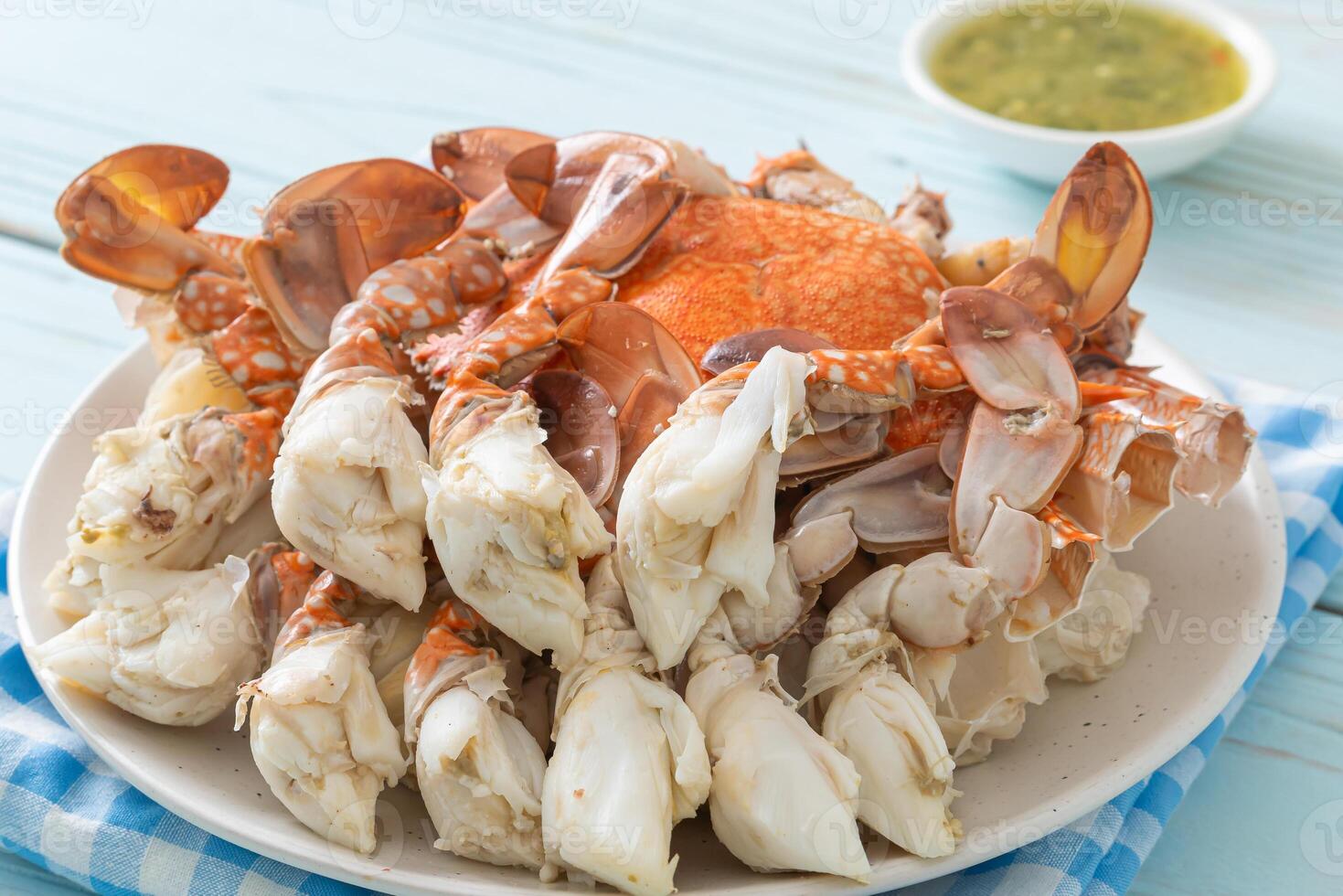 Steamed blue crab with spicy seafood sauce photo