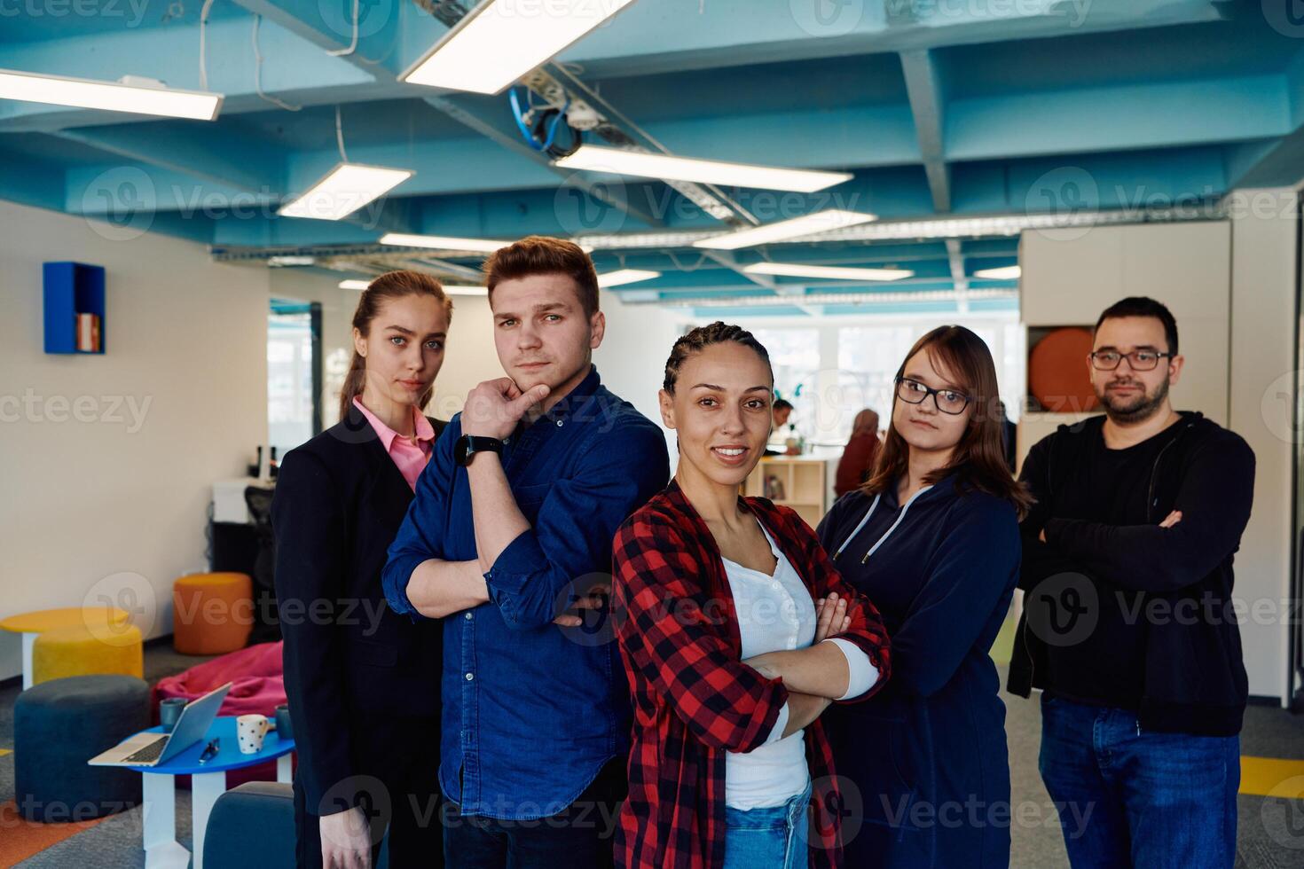 Portrait of a successful creative businessman and businesswoman looking at camera and smiling. Diverse business people standing together at startup. photo