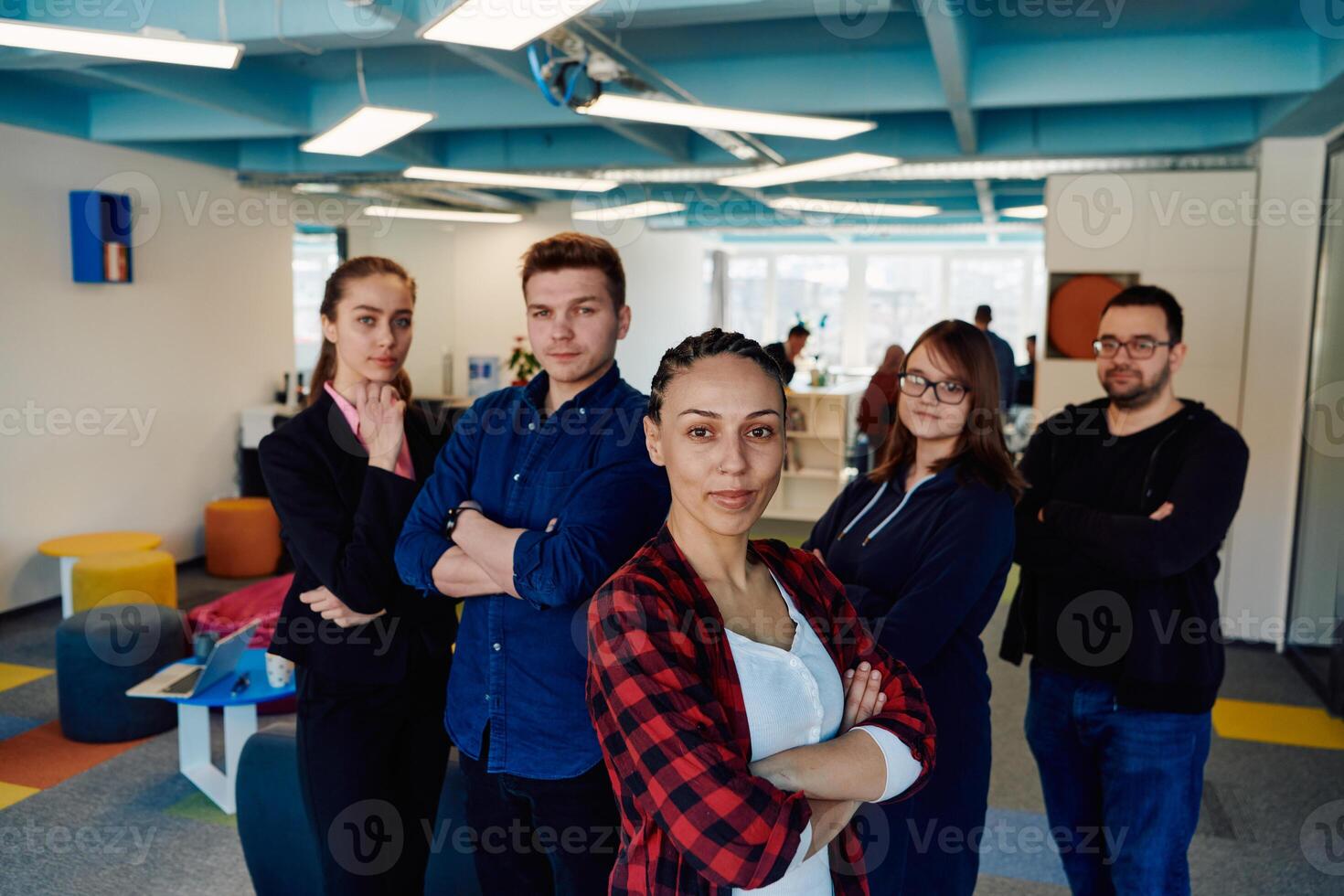 Portrait of a successful creative businessman and businesswoman looking at camera and smiling. Diverse business people standing together at startup. photo