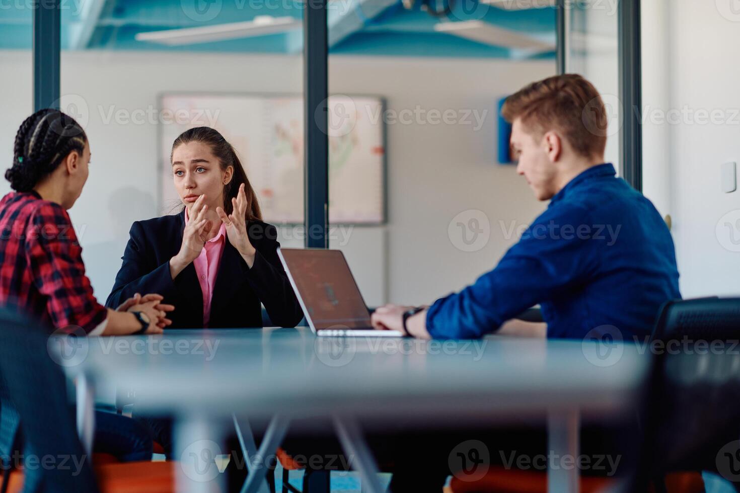 A team of successful programmers sits in a startup office, strategizing new business projects and solving existing challenges, showcasing innovation and collaboration in the tech industry photo