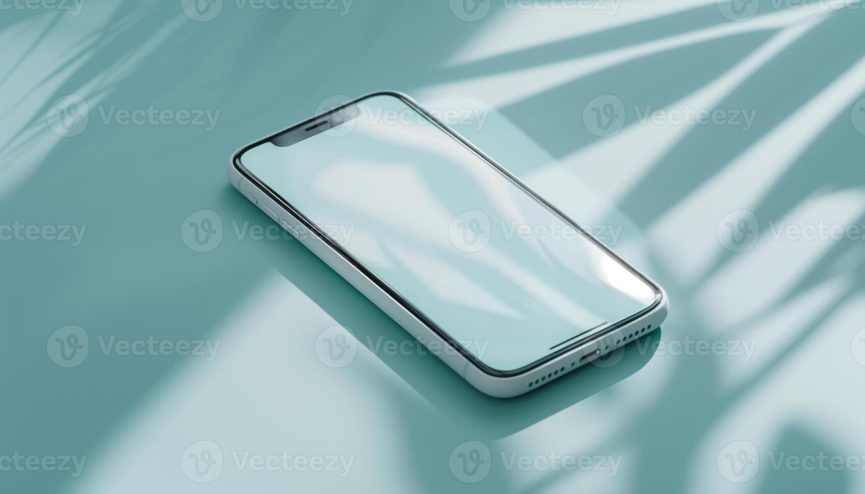Modern Smartphone on Light Blue Surface with Leaf Shadows photo