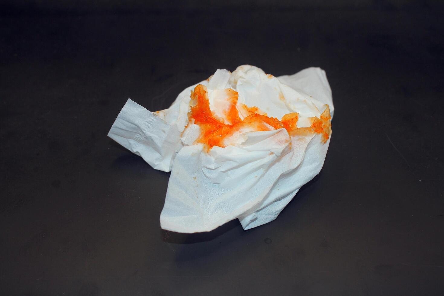 tissue with red stains, tissue with yellow background photo