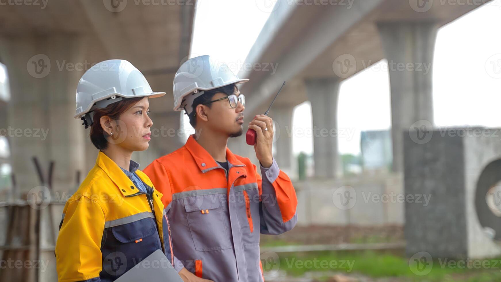 Asian engineering team Inspecting construction work radio command concrete road bridge highway photo