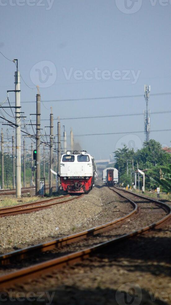 View of a passenger train moving in a rural or hilly area photo