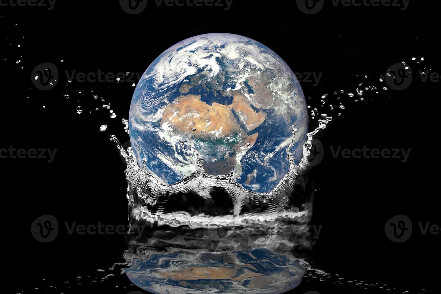 Earth Splashing into Water with Black Background - Conceptual Environmental Image photo