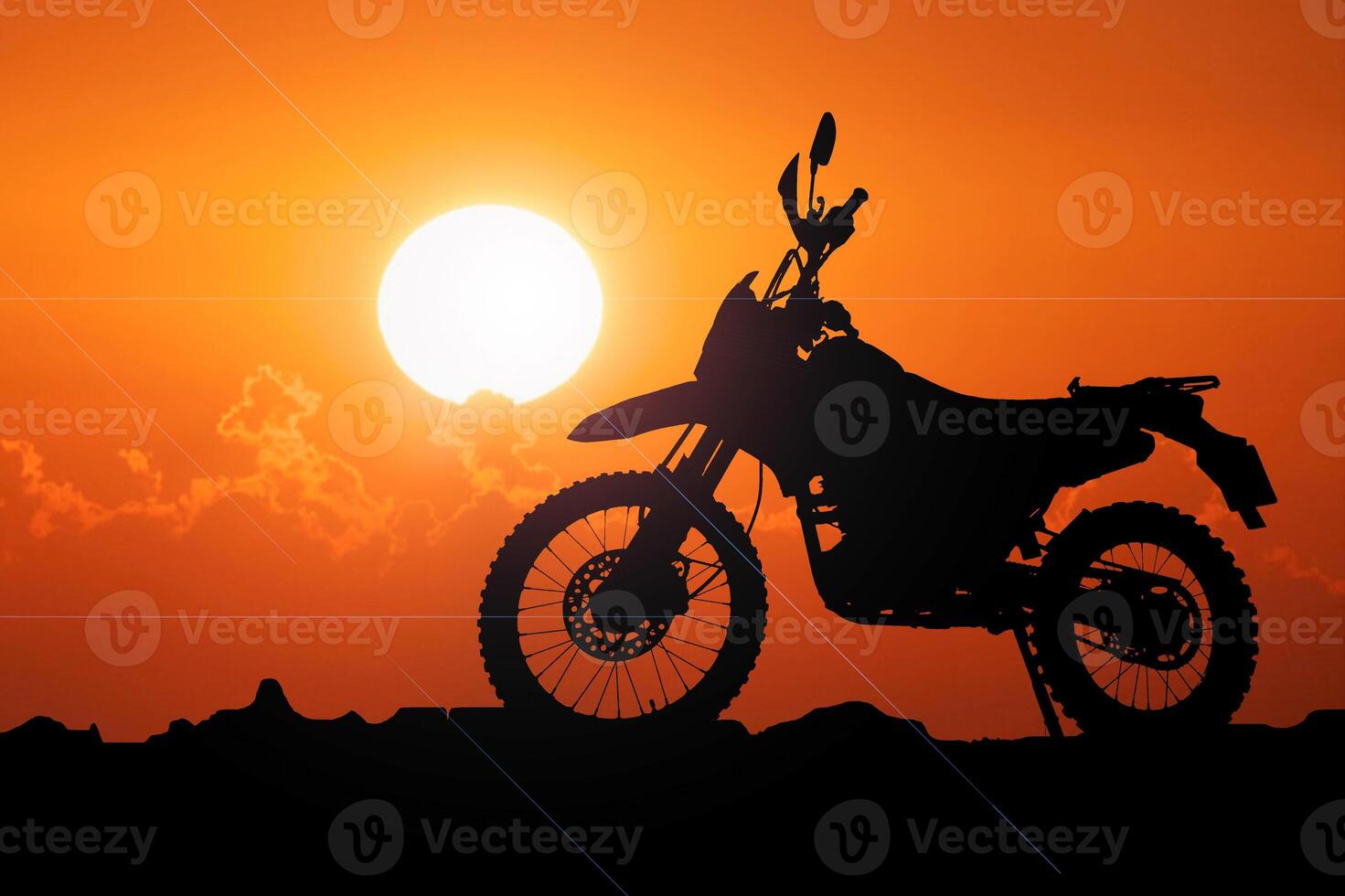 silueta de un motocicleta en contra un vibrante naranja puesta de sol con un claro cielo foto