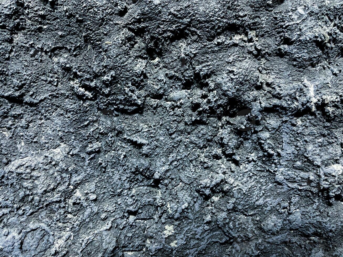 close up view old grunge wall with rough stone texture background photo