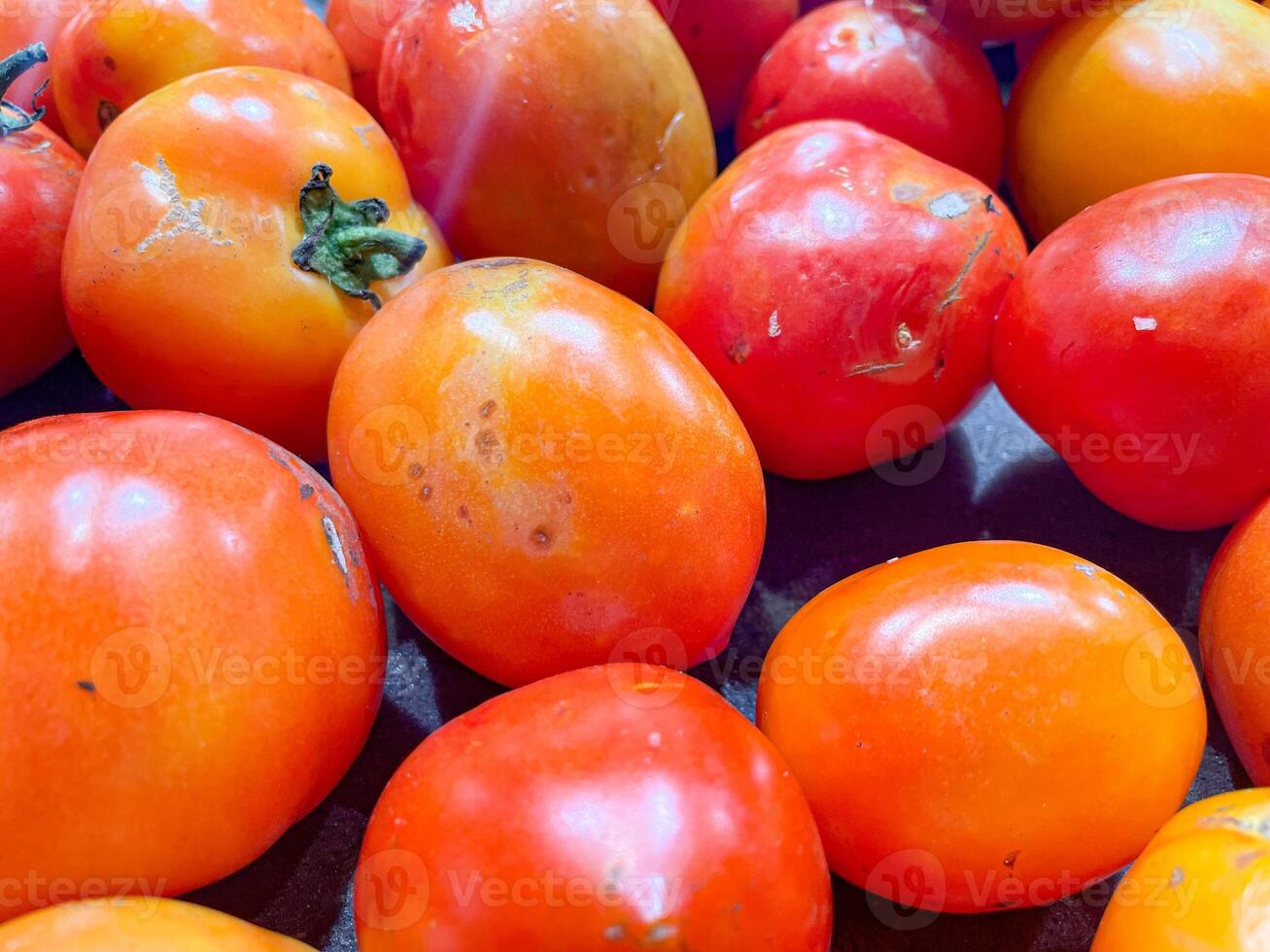 top view of pile of delicious fresh ripe tomatoes as food background texture photo