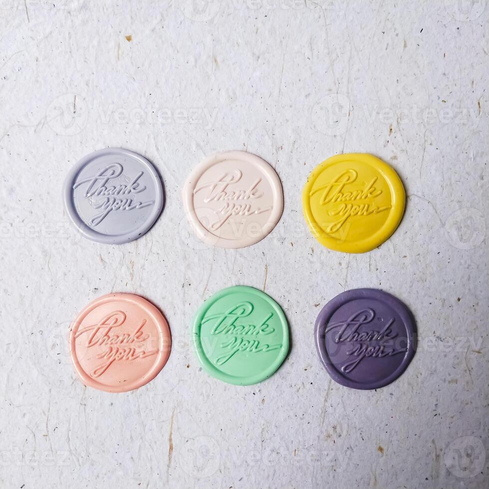 colorful wax stamp on white background. isolated. round photo