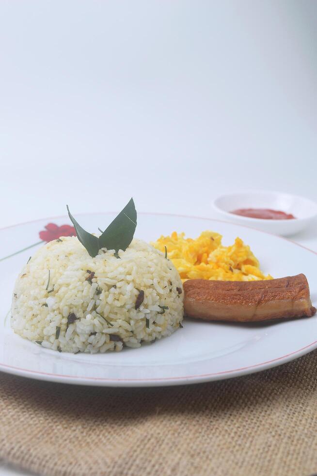 Indonesian specialties namely a plate of lime leaf fried rice which is a blend of rice photo