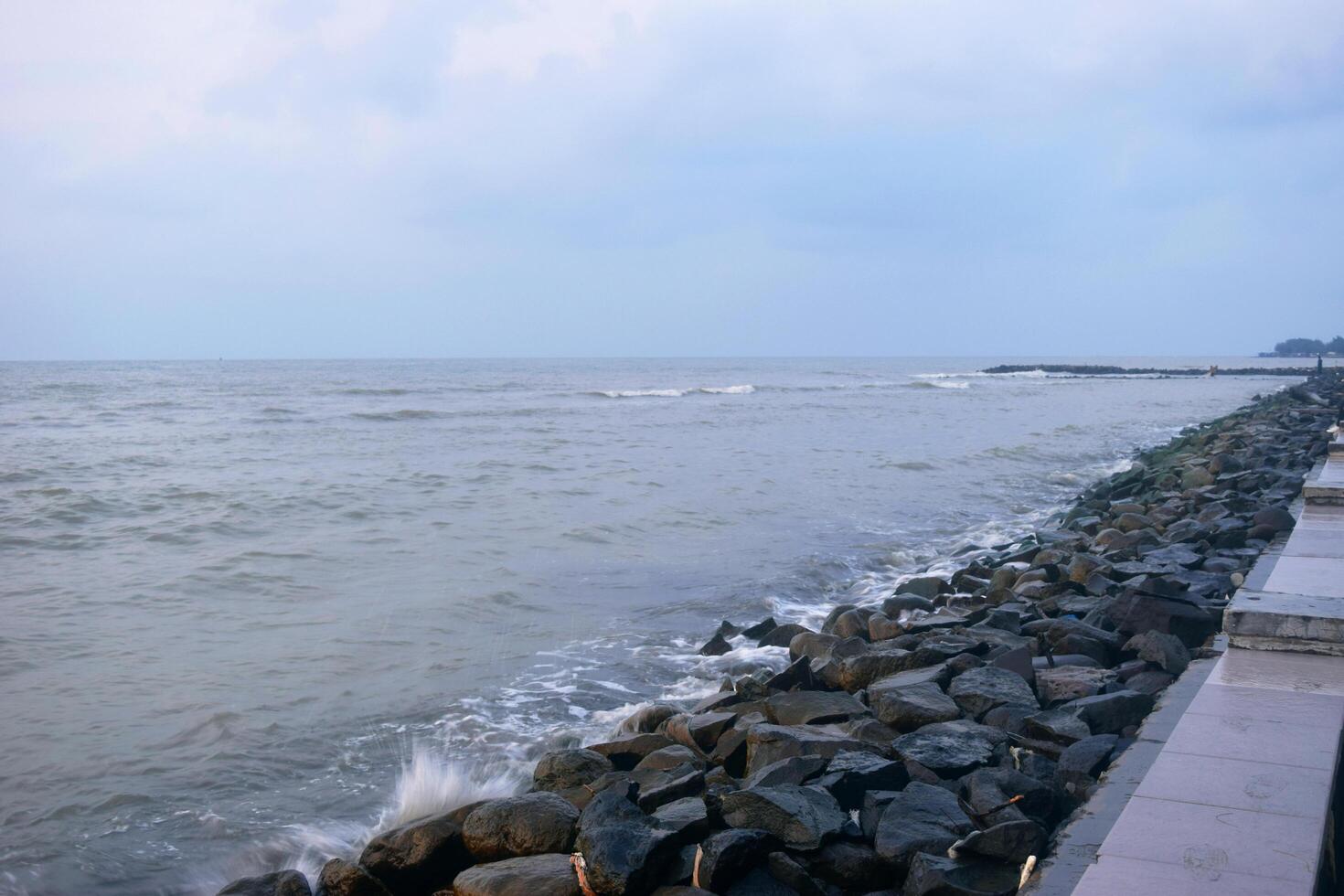 Atmosphere on the beach cities of Tegal which is often called Pantai Alam Indah photo