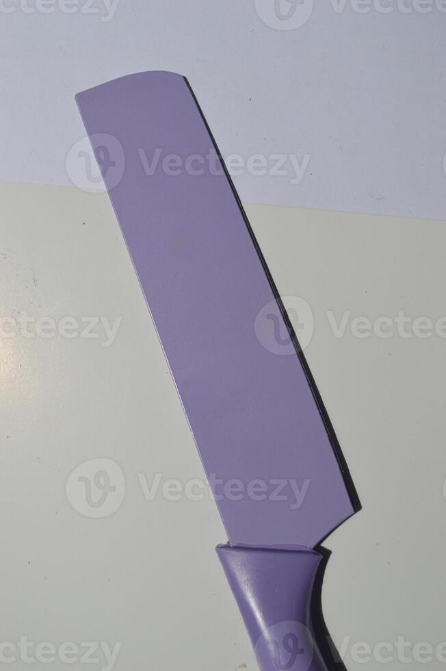 sharp kitchen knives used for cooking, knife set of various shapes and uses put together on a white background photo