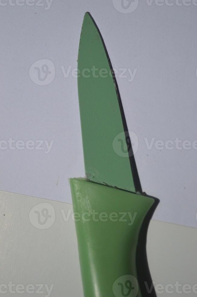 sharp kitchen knives used for cooking, knife set of various shapes and uses put together on a white background photo