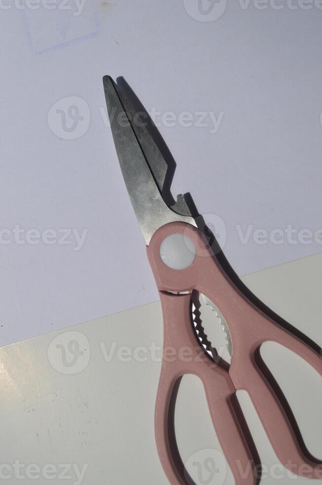 sharp kitchen knives used for cooking, knife set of various shapes and uses put together on a white background photo