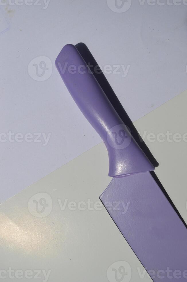 sharp kitchen knives used for cooking, knife set of various shapes and uses put together on a white background photo