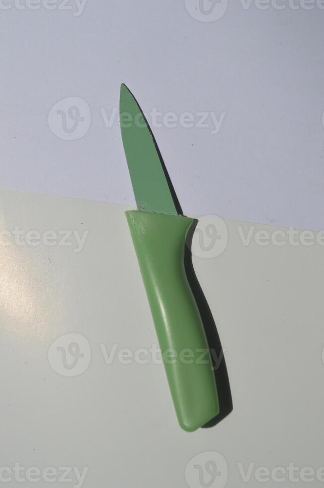 sharp kitchen knives used for cooking, knife set of various shapes and uses put together on a white background photo