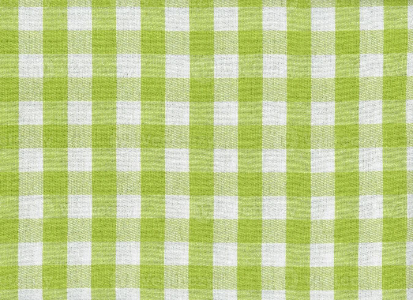 green and white chequered fabric texture background photo