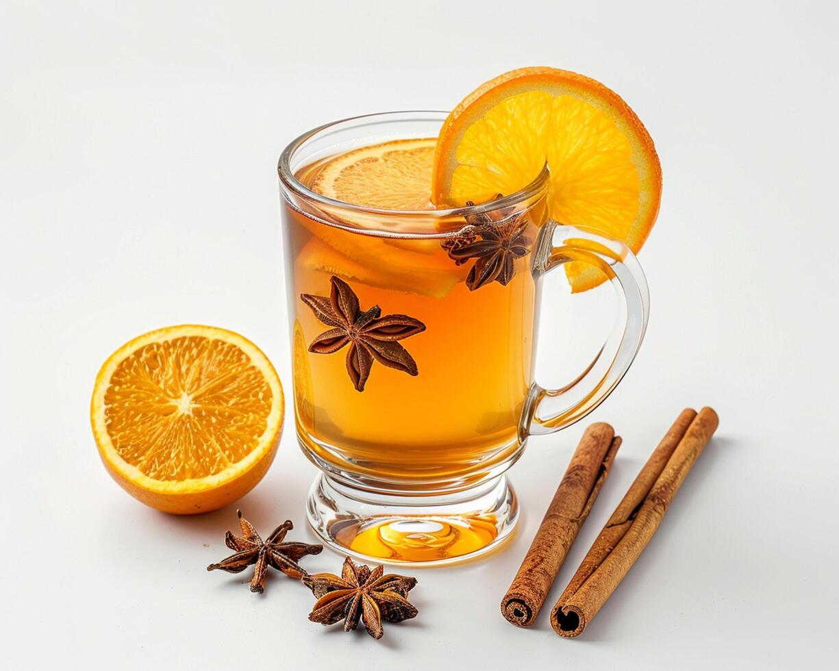 a glass of tea with orange slices and cinnamon photo