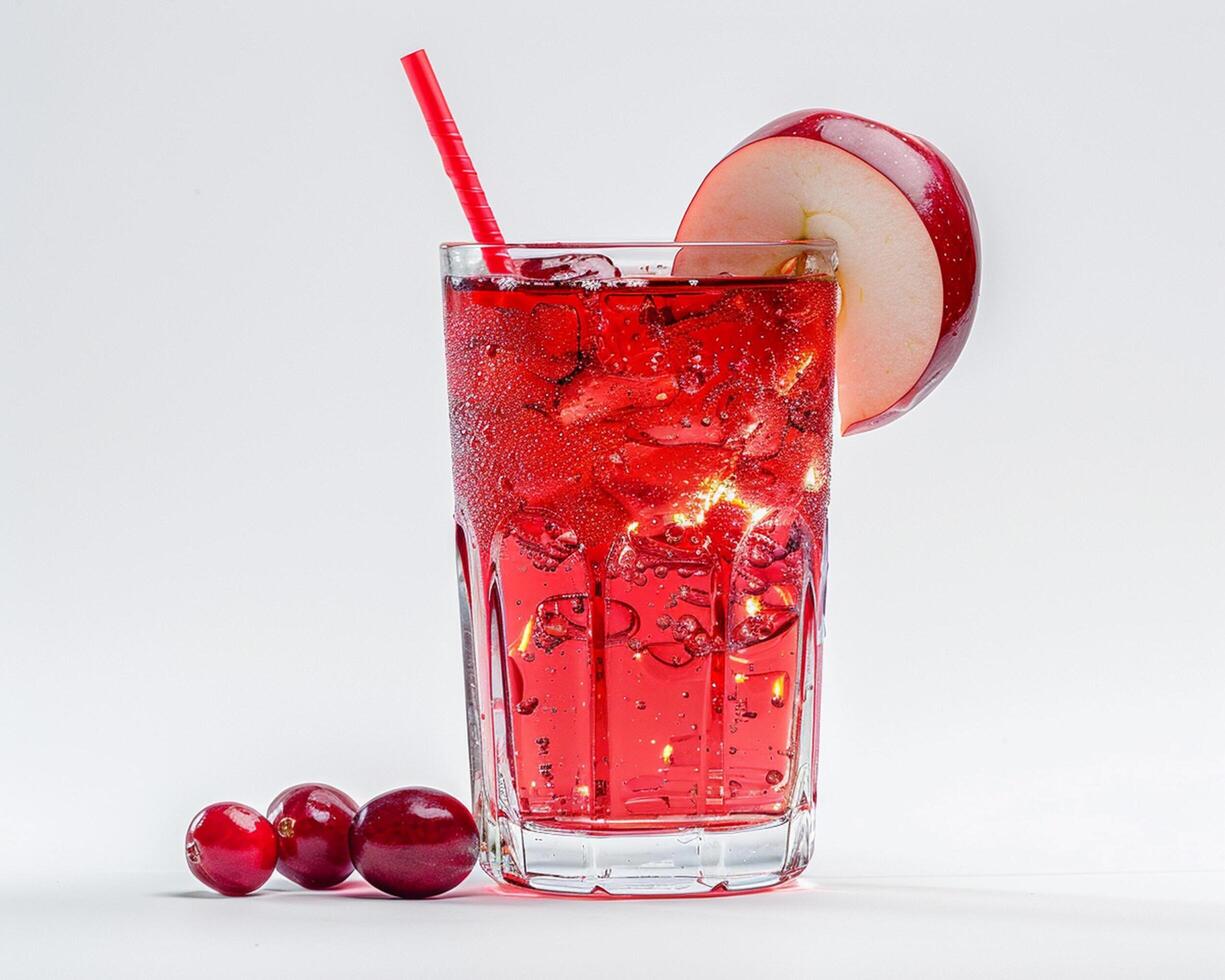 a glass of red drink with a cherry on top photo