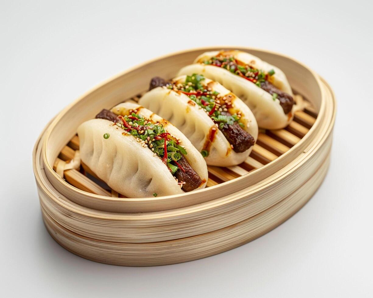three dumplings in a bamboo steamer photo