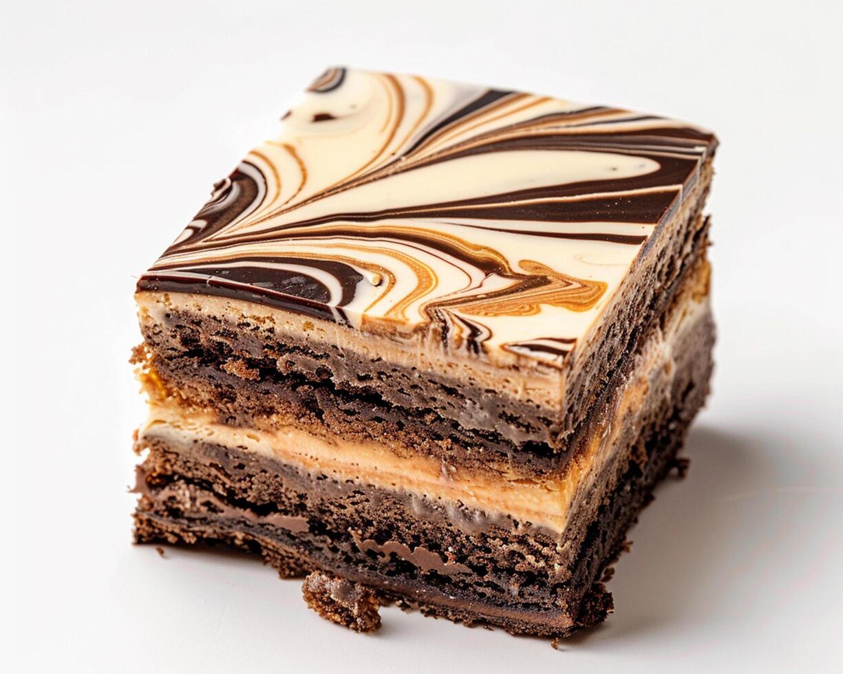 a piece of chocolate cake with a swirl of brown and white photo