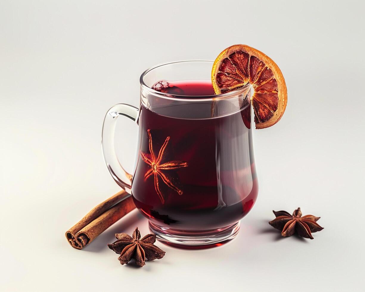 a glass of mulled wine with an orange slice and cinnamon photo