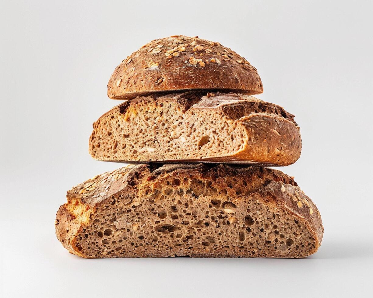 three loaves of bread stacked on top of each other photo